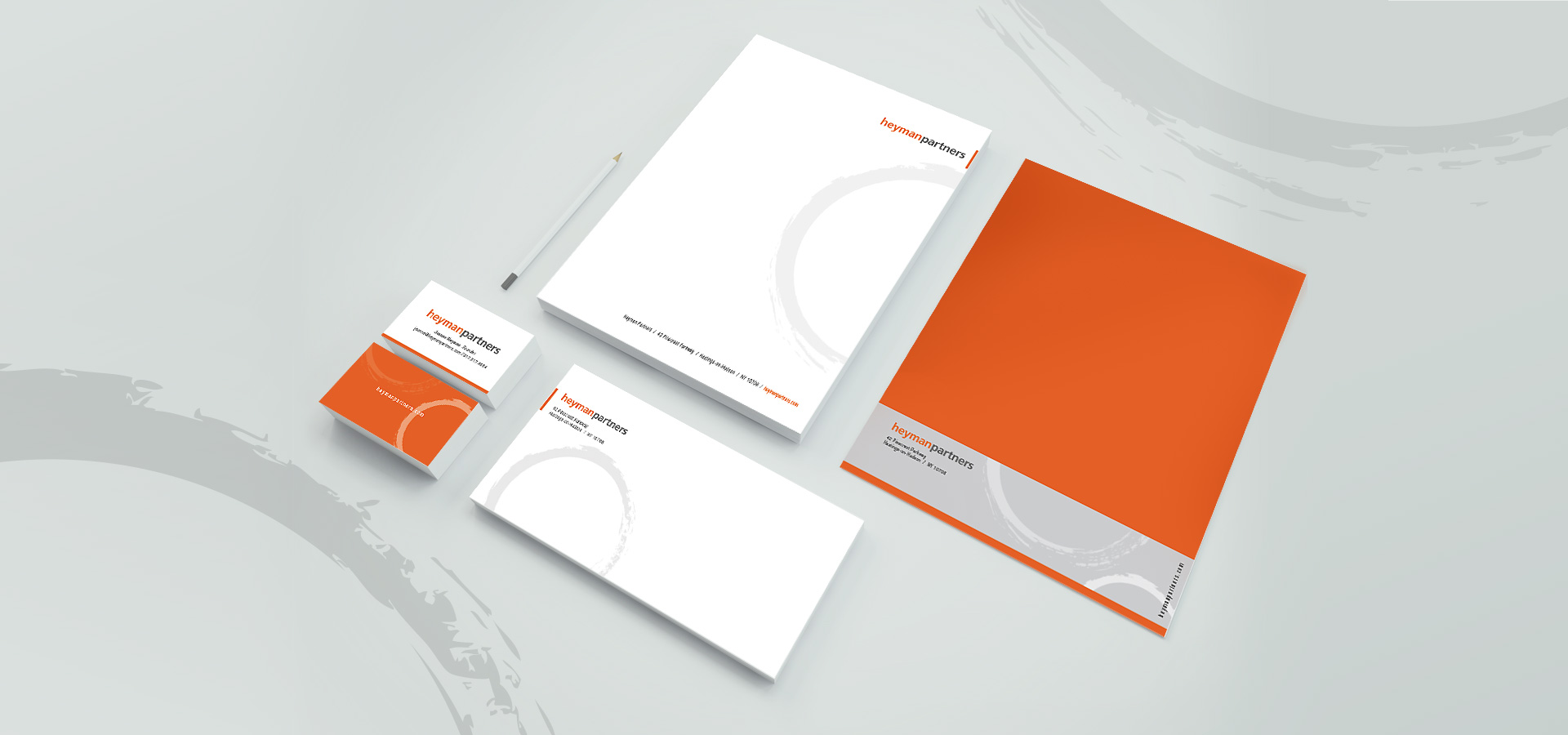 orange and gray tone stationery design including business card, letterhead, envelope and business folder for heyman partners